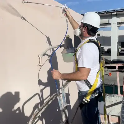 painter applying an industrial coating